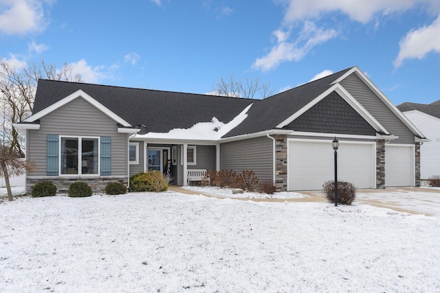 view of front of home with covered porch and a garage