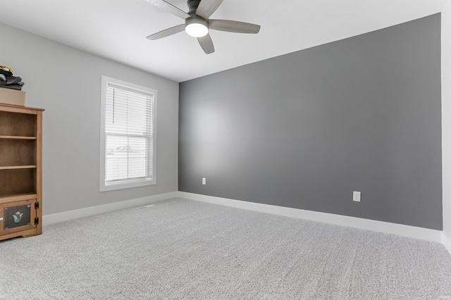 carpeted empty room with ceiling fan