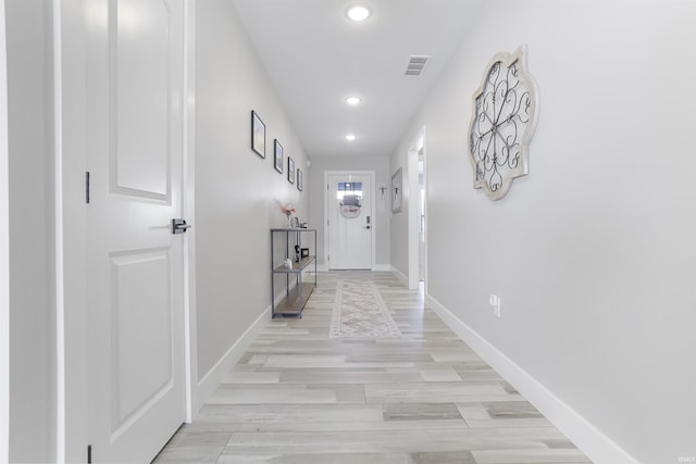 hallway featuring light hardwood / wood-style floors