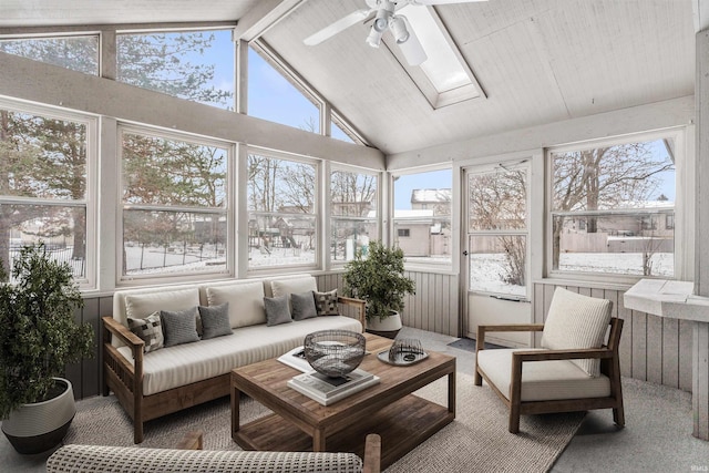 sunroom with vaulted ceiling with skylight, ceiling fan, and a healthy amount of sunlight