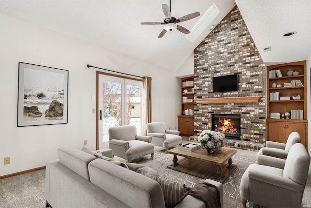 carpeted living room featuring ceiling fan, a fireplace, high vaulted ceiling, and built in shelves