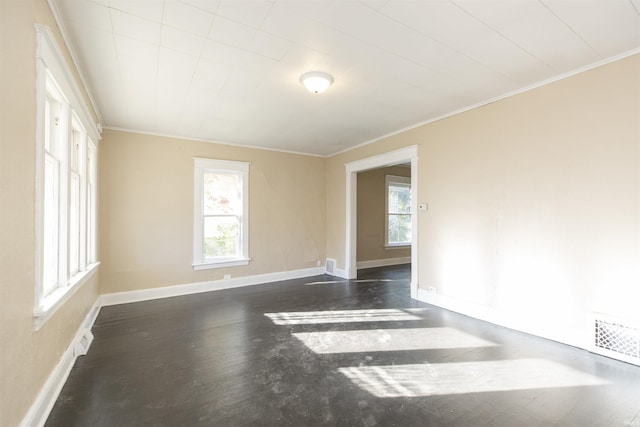 spare room with dark hardwood / wood-style floors and crown molding