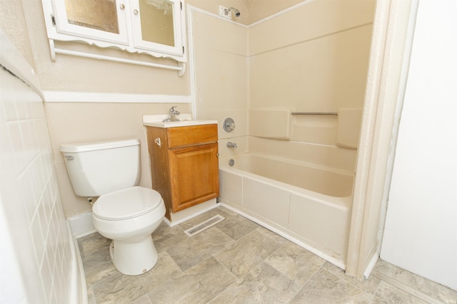 full bathroom featuring shower / bath combo, vanity, and toilet