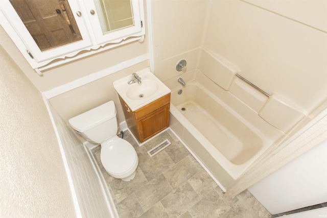 full bathroom featuring vanity, toilet, and washtub / shower combination