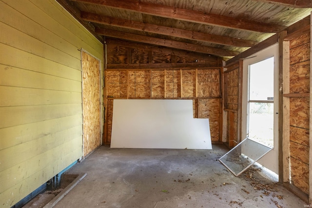 miscellaneous room featuring lofted ceiling with beams, wood ceiling, and wooden walls