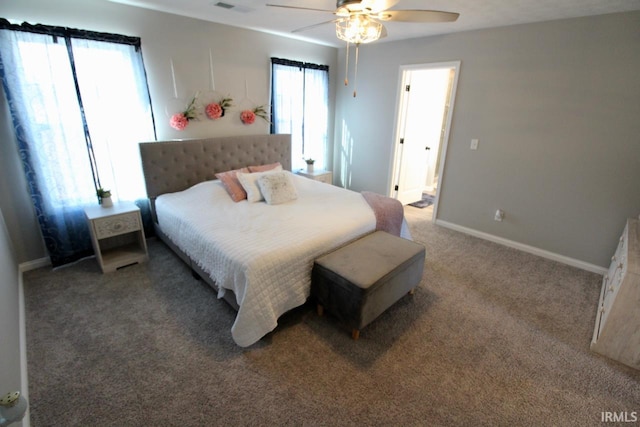 bedroom with carpet flooring, multiple windows, and ceiling fan