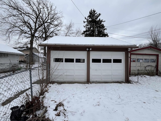 view of snow covered garage