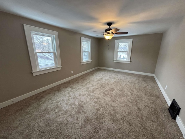 spare room with carpet flooring and ceiling fan