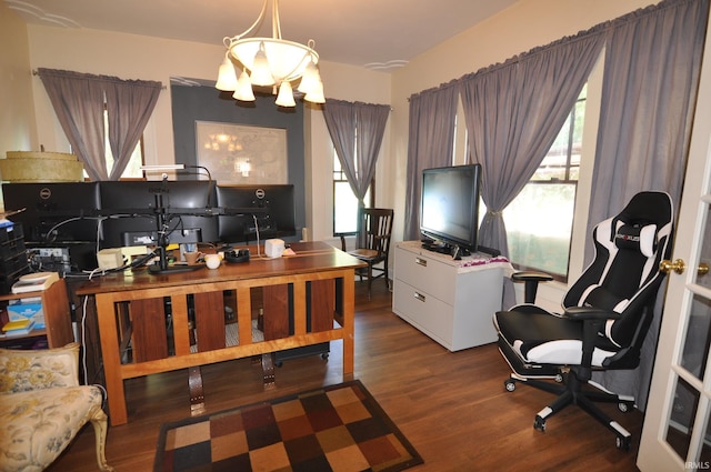 office space featuring dark hardwood / wood-style floors and an inviting chandelier