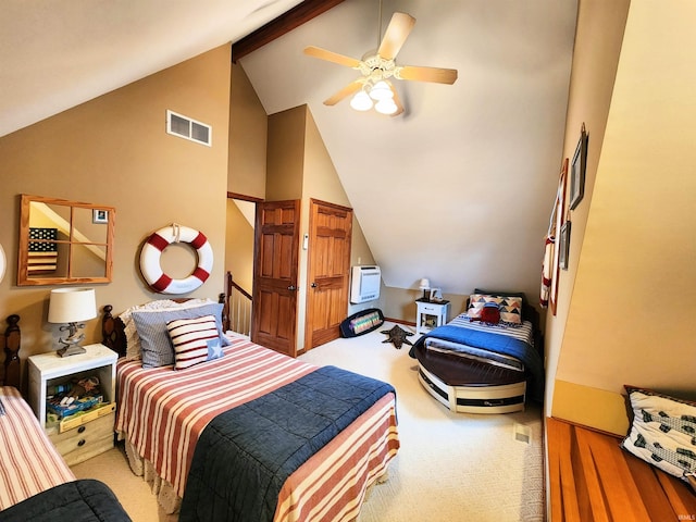 carpeted bedroom featuring ceiling fan and vaulted ceiling