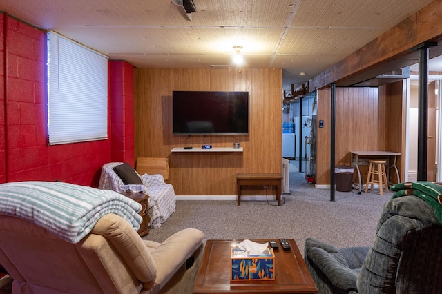 carpeted living room with wood walls and wood ceiling