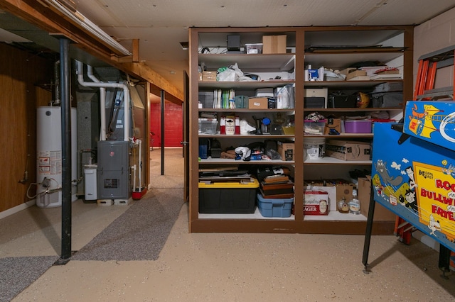 storage room with heating unit and water heater