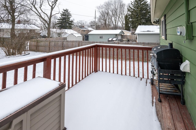 snow covered deck featuring area for grilling