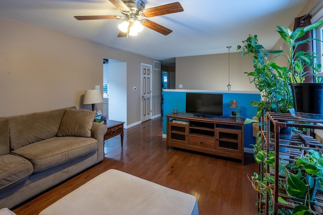 living room featuring dark hardwood / wood-style floors and ceiling fan