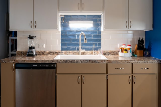 kitchen featuring dishwasher, backsplash, and sink