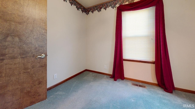 unfurnished room featuring carpet flooring