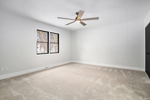 empty room with carpet and ceiling fan