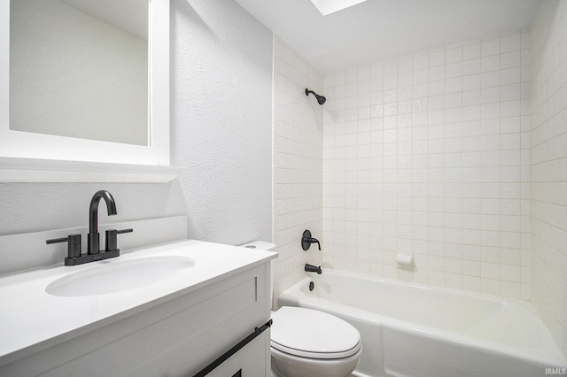 full bathroom with shower / tub combination, vanity, and toilet