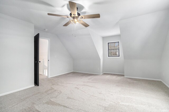 bonus room with light colored carpet, ceiling fan, and lofted ceiling