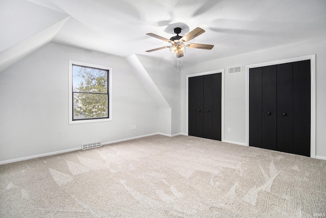 bonus room with ceiling fan, carpet floors, and vaulted ceiling