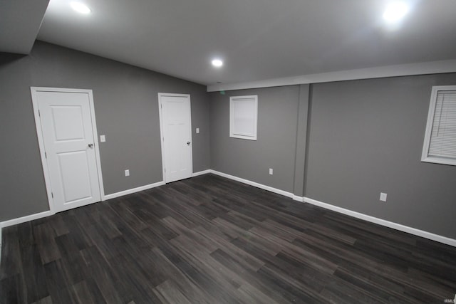 basement featuring dark wood-type flooring