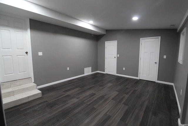 basement featuring dark hardwood / wood-style flooring