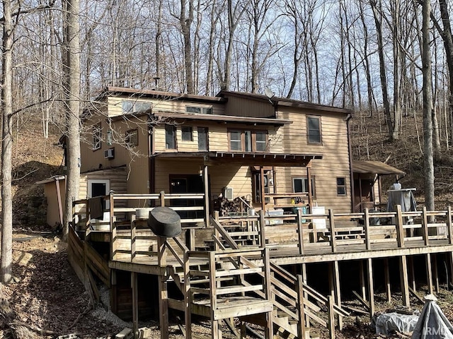 rear view of property featuring a deck