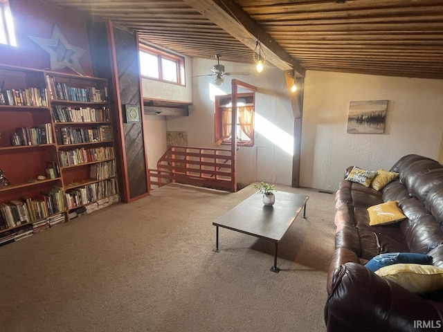 living room featuring carpet flooring, ceiling fan, and beam ceiling