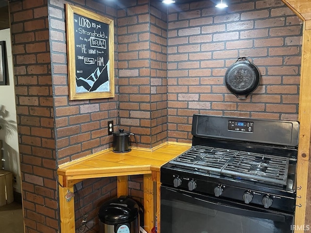 interior space with black range with gas cooktop