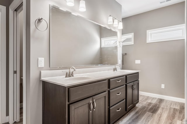 bathroom featuring wood-type flooring and vanity