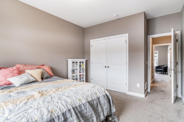 carpeted bedroom featuring a closet