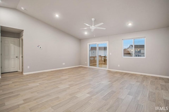 empty room featuring light wood-type flooring, ceiling fan, and lofted ceiling