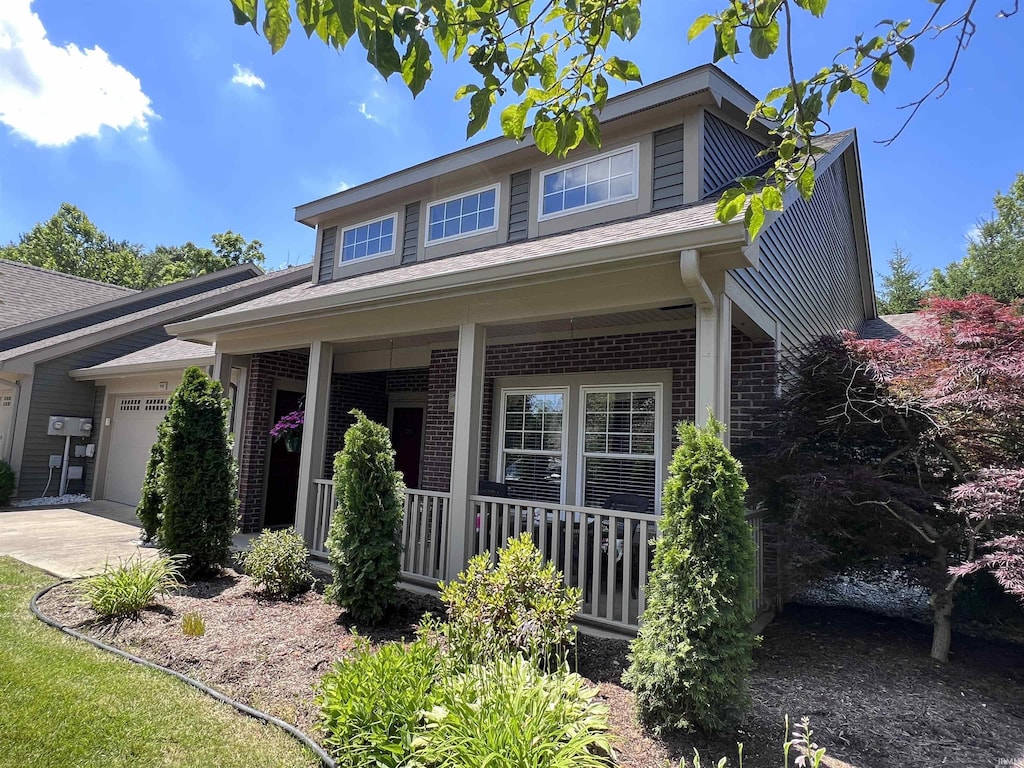 950 S Baldwin Dr, Bloomington, IN 47401 - view of front facade featuring a porch and a garage