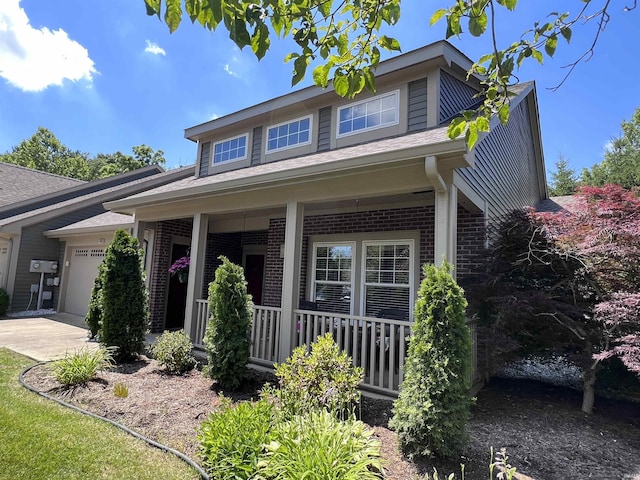 view of front facade featuring a porch and a garage