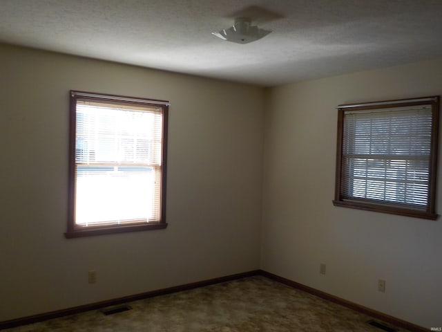 empty room featuring carpet floors