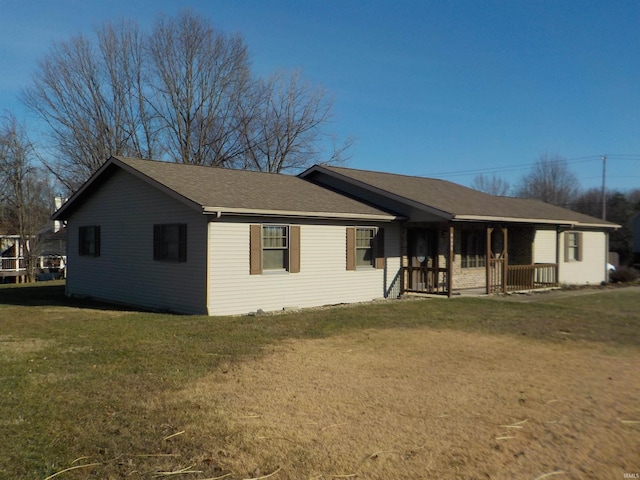 view of front of home featuring covered porch and a front yard