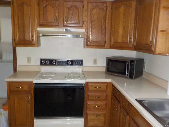 kitchen with washer / dryer and electric stove