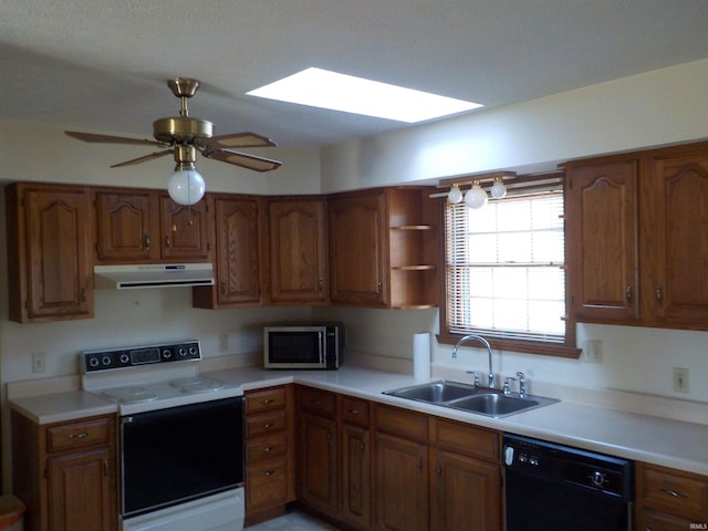 kitchen featuring sink, a skylight, electric range, ceiling fan, and black dishwasher