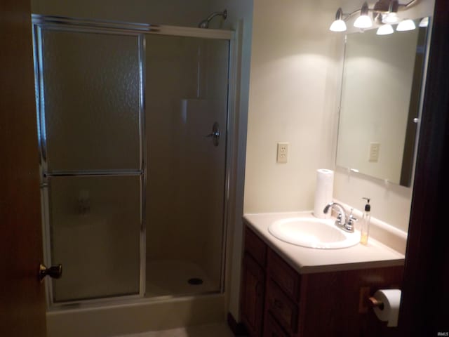 bathroom featuring vanity and walk in shower