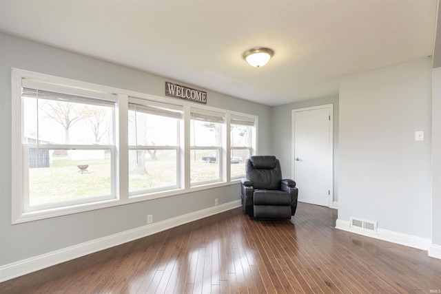 unfurnished room featuring dark hardwood / wood-style floors