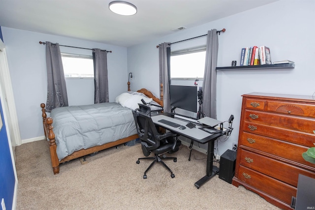 bedroom featuring light carpet