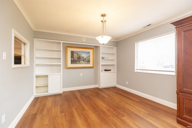 unfurnished dining area featuring hardwood / wood-style flooring