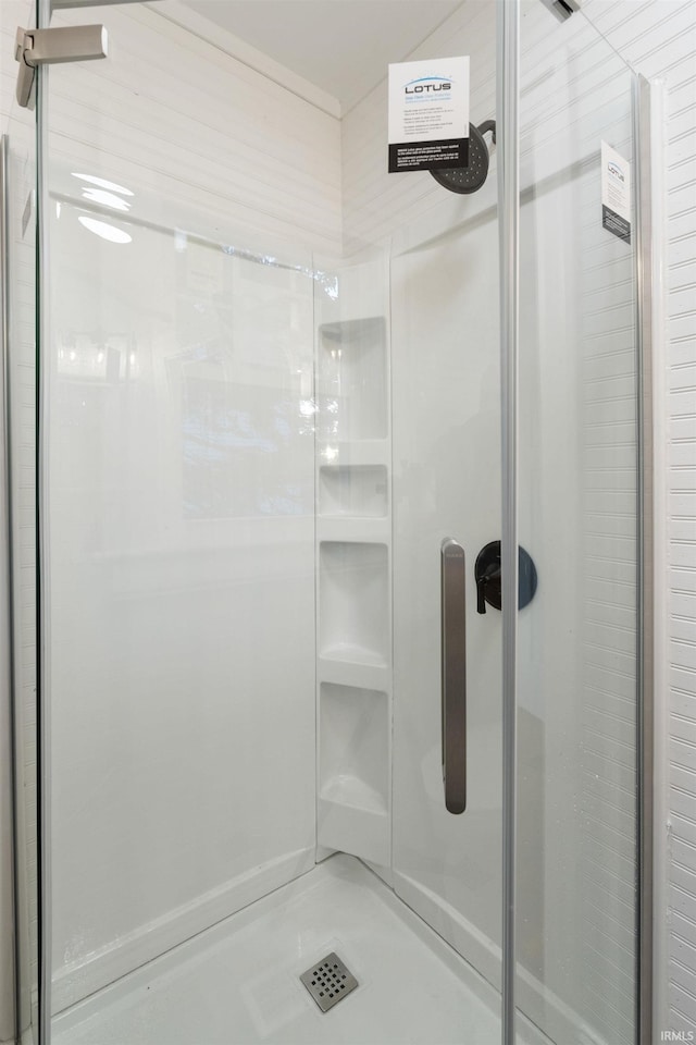 bathroom featuring an enclosed shower