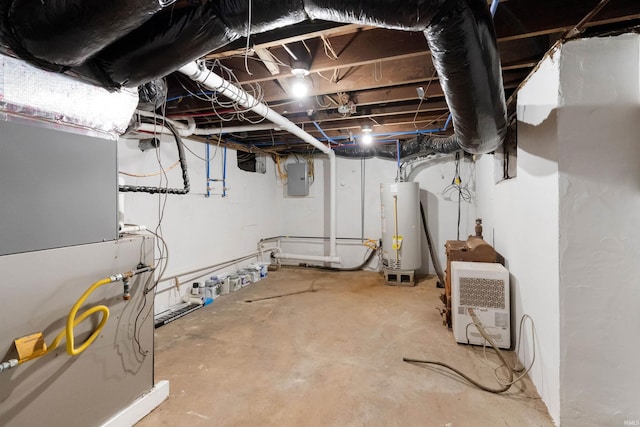 basement featuring gas water heater, electric panel, and heating unit