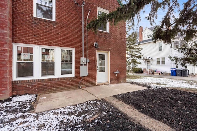 view of snow covered property entrance