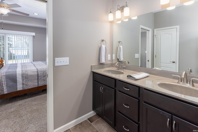 bathroom featuring ceiling fan and vanity