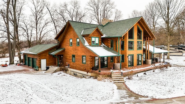 view of front of house featuring a porch and a garage