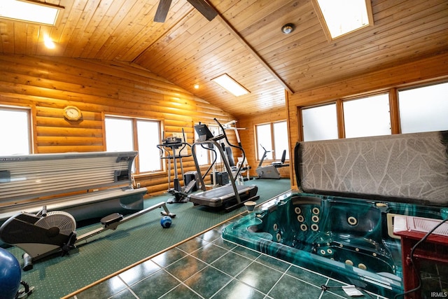 interior space with a hot tub, rustic walls, wood ceiling, and vaulted ceiling with skylight