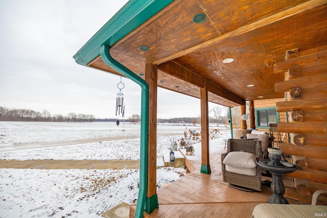 view of snow covered deck