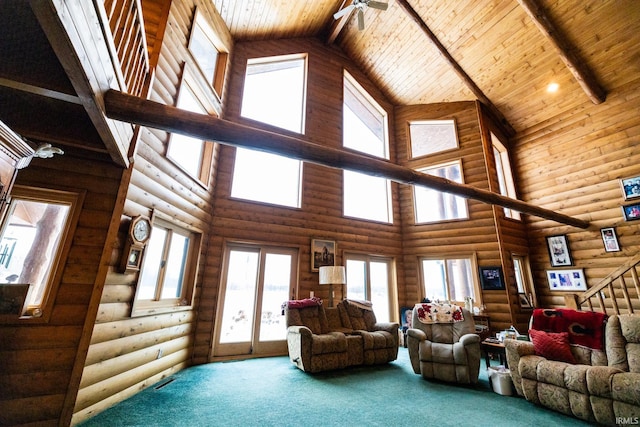 carpeted living room with rustic walls, high vaulted ceiling, and wood ceiling